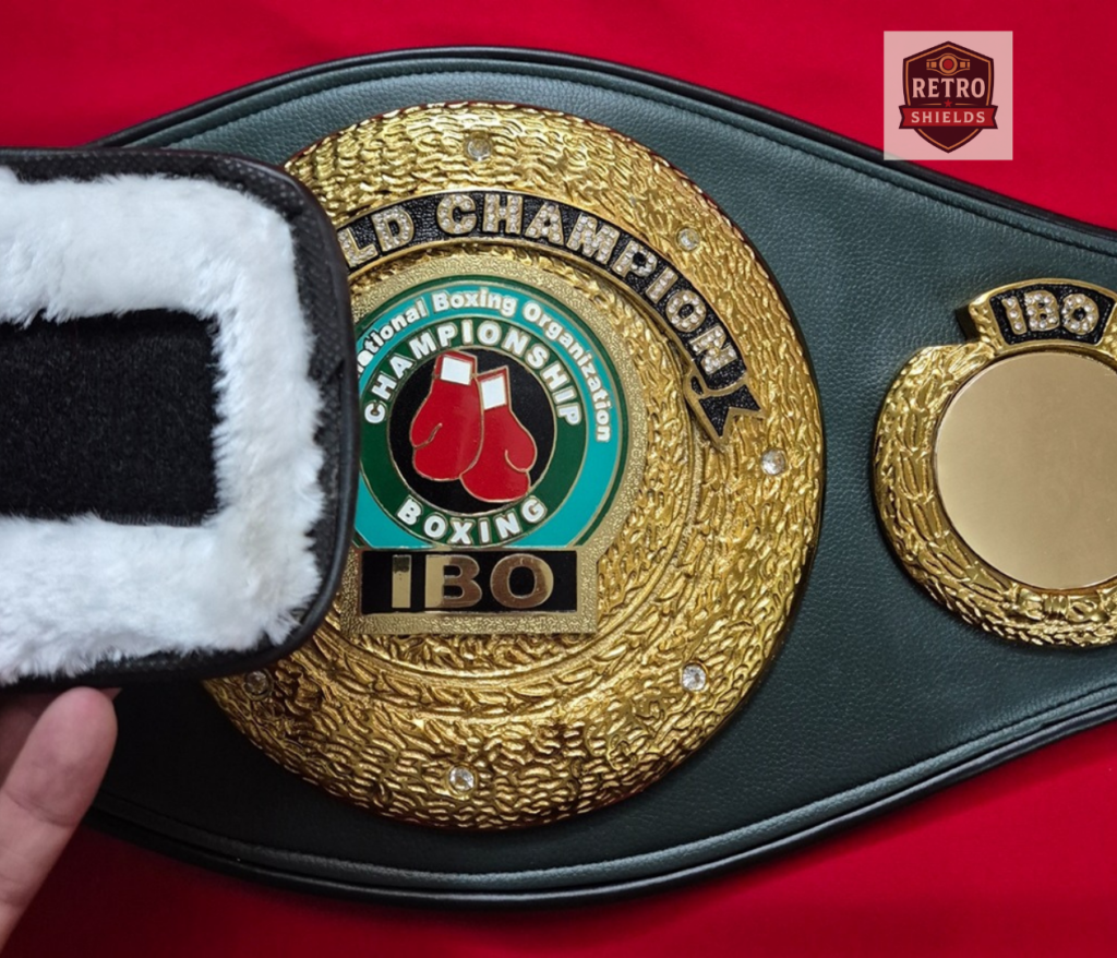 Close-up of IBO world championship belt center plate with deep relief silver mold cast detailing