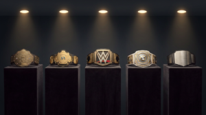 a display of championship wrestling belts spanning different eras of design