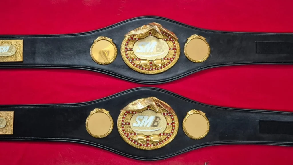 Row of matching cheap custom championship belts from one bulk order