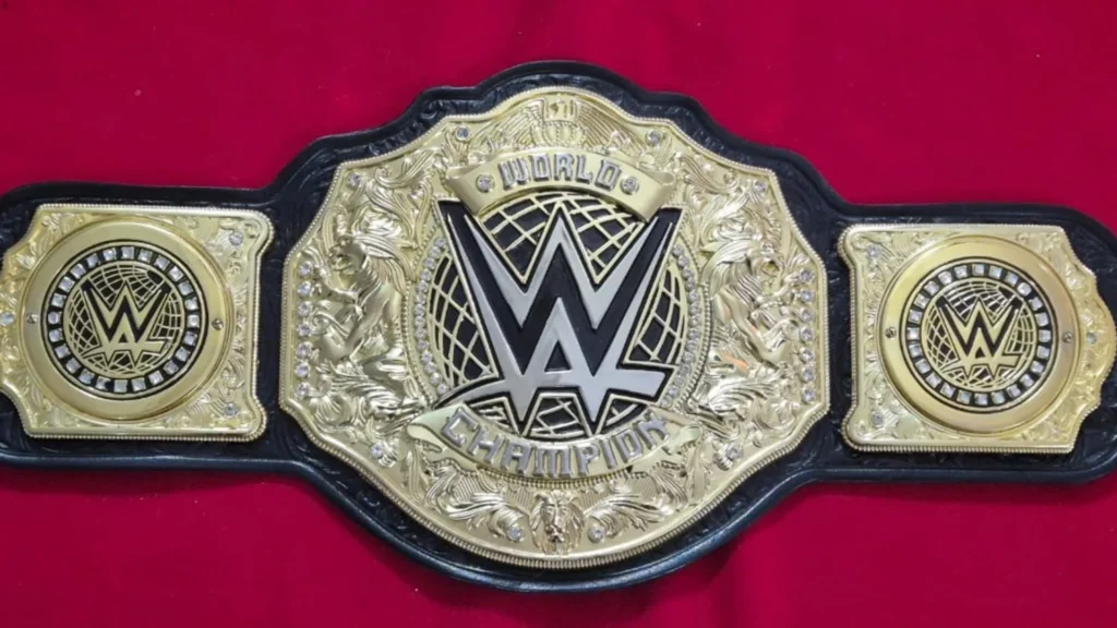 Close up of an etched brass center plate on a cheap WWE style championship belt