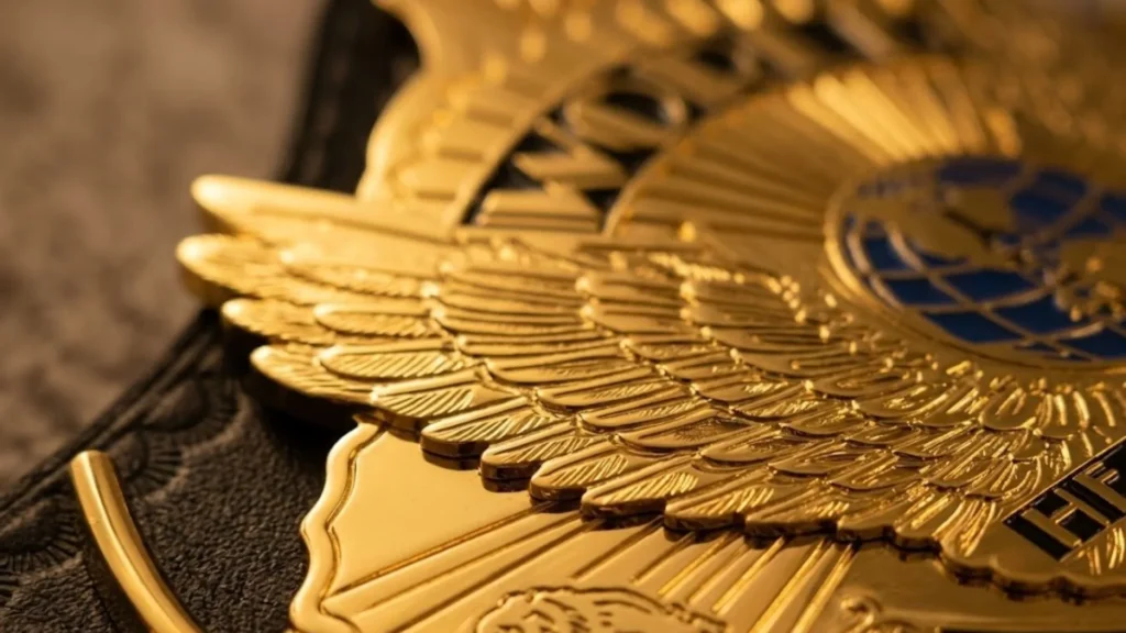 Close up of the Winged Eagle wings extending past the edge of the center plate on a replica championship belt
